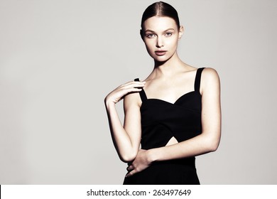fashion model portrait. beautiful young woman on grey background