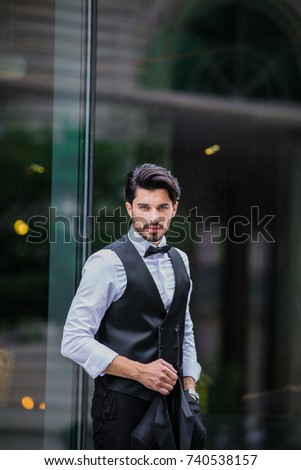 Similar – Thoughtful young man sitting on an urban bench