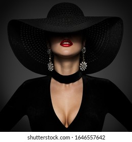 Fashion Model in Sexy Black Dress, Elegant Woman Beauty in Wide Broad Brim Hat covered face