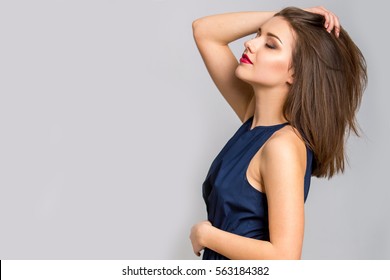 Fashion Model With Straight Hair. Young Beautiful Woman Posing At Studio