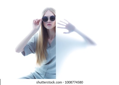 Fashion Model In Sunglasses, Beautiful Young Woman. Studio Shot