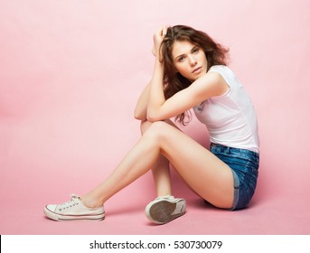 Fashion Model, Fashion, Teenage Girls. Posing over pink background.