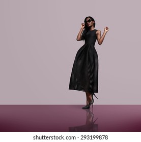 Fashion Model Wearing Black Dress And Sunglasses