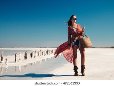 Fashion Model Wearing Bohemian Chic Clothing Posing On The Salt Beach Outdoor.