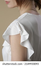 Fashion Model Wearing White Peasant Blouse, Close Up, Studio Shot.