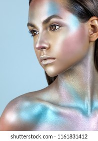 Fashion model woman with trendy metallic make-up. Glitter vivid makeup. Fashion makeup