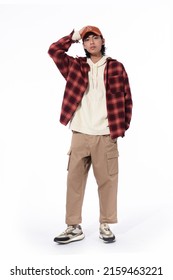 Fashion Model. Young Man With Hairstyle In Paid Shirt ,hoodie ,hat On White Background

