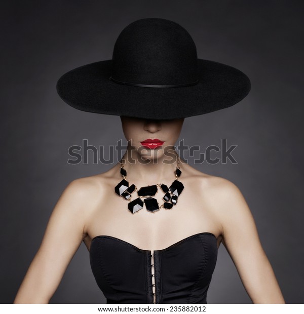 Fashion\
photo of beautiful lady in elegant black\
hat