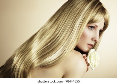 Fashion Photo Of A Young Woman With Blond Hair. Close-up Portrait