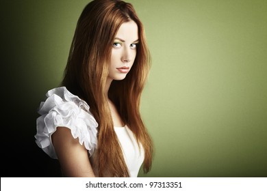 Fashion Photo Of A Young Woman With Red Hair. Close-up