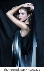 Fashion Pictures Of A Beautiful Woman Wearing Silk Fringe Black And White Dress Chinese Style Doing Martial Arts Posture