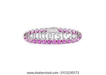 Fashion pink sapphire bracelet on white background. Pink gemstones in white gold, jewelry theme.