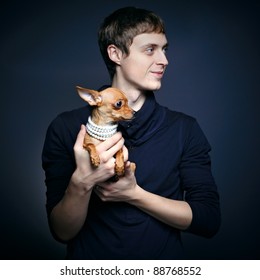 Fashion Portrait Of Beautiful Man With Small Dog