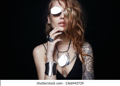 Fashion Portrait Of Beautiful Sexy Woman With Tattoo. Beauty Tattooed Girl In Sunglasses And Jewelry