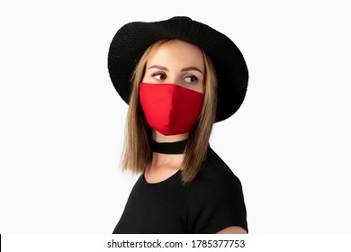 Fashion portrait of beautiful woman in fashionable protective mask. Trendy clothes and accessories. New normal concept