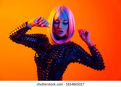 Fashion portrait of beautiful woman on colored background