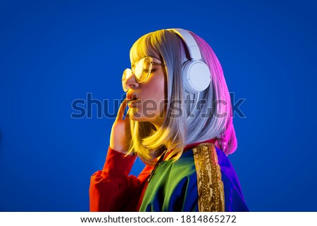 Fashion portrait of beautiful woman on colored background