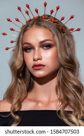 Fashion Portrait Of Beautiful Young Model With Professional Makeup, Perfect Skin And Halo Crown On Her Head.