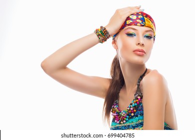 Fashion Portrait Of A Beautiful Young Woman In Headscarf. Colored Makeup
