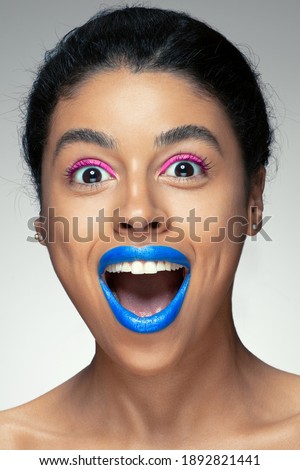 Fashion portrait of a black girl. Studio shooting. Bright makeup