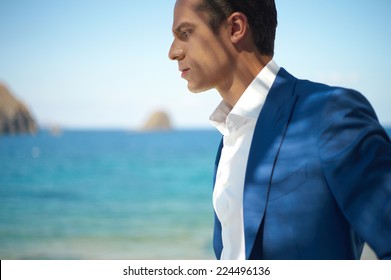 Fashion Portrait Of A Handsome Man In Blue Suit