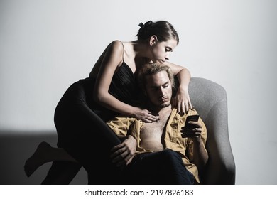 Fashion Portrait Of Stylish Young Pretty Couple In Love Hugs. Couple In Love On Date In Formal Fashion Look.