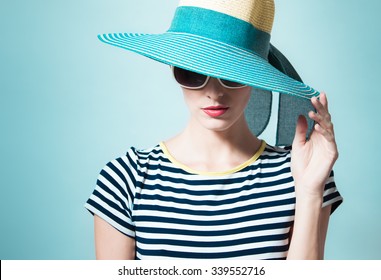 Fashion Portrait Of Woman Wearing Hat