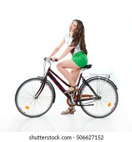 Fashion Pretty Woman With Retro Vintage Bicycle Over White Background. Girl With Bike In Studio. Cheerful Young Woman Riding Her Bike, Summertime, Isolated.