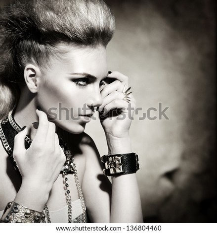 Fashion Rocker Style Model Girl Portrait. Hairstyle. Rocker or Punk Woman Makeup and Hairdo. Black and White Portrait of Glamour and Stylish Young Woman