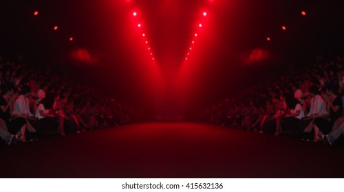 Fashion runway in red lighting out of focus,blur background