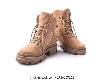 Fashion shoes with rough tread on sole. Beige leather boots on laces for street style isolated on white background