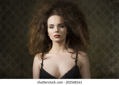 Fashion Shoot Of Sensual Brunette Woman With Voluminous Creative Hair-style, Black Bra And Cute Make-up 