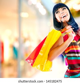 Fashion Shopping Girl Portrait. Beauty Woman With Shopping Bags In Shopping Mall. Shopper. Sales. Shopping Center