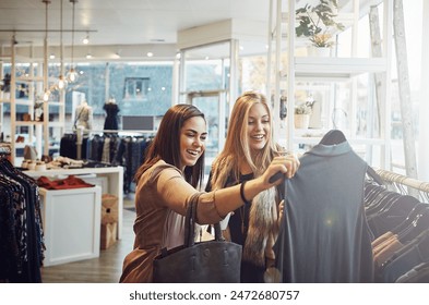 Fashion, shopping and help customer with clothes for decision, sales or discount at luxury mall. Smile, retail store or client with fabric at boutique for choice or advice with women talking at shop - Powered by Shutterstock