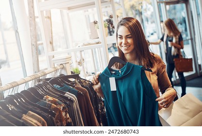 Fashion, shopping or woman in clothes store for choice, sales or discount at luxury mall. Smile, retail shop or customer with fabric at boutique or showroom on rack for purchase decision on promotion - Powered by Shutterstock