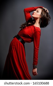 Fashion Shot Of A Gorgeous Young Woman In Elegant Red Dress.