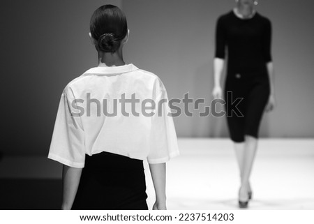 Fashion Show, catwalk runway event, model walking the show finale.