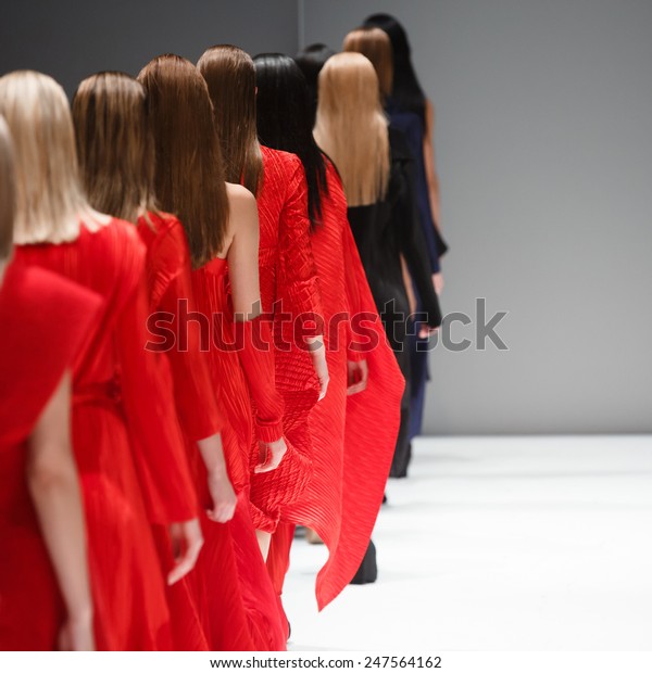 fashion show runway aisle seated legs