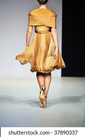 Fashion Show Event And Beautiful Young Woman At Piste Walking In Luxury Dress
