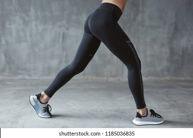 Fashion Sportswear. Fit Long Woman Legs In Leggings And Sneakers