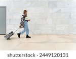 Fashion student walking through the airport
