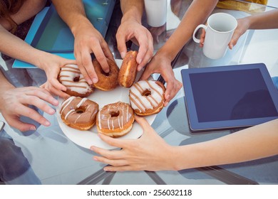 Fashion Students Eating Doughnuts At The College