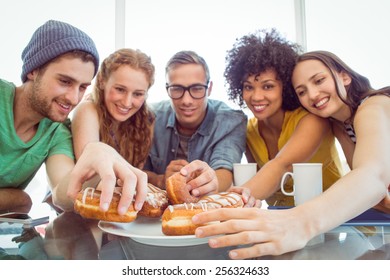 Fashion Students Eating Doughnuts At The College