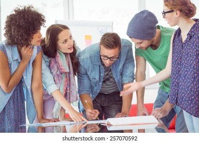 Fashion students working as a team at the college - Powered by Shutterstock