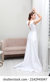 Fashion Studio Photo Of Delicate Brunette Bride In Simple Minimalist Luxurious Dress. Wedding Salon. Bridal Modest Dress Collection 2022