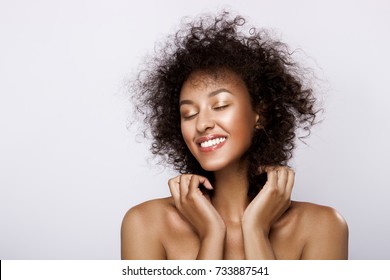 Fashion Studio Portrait Of Beautiful African American Woman With Perfect Smooth Glowing Skin, Nude Make Up