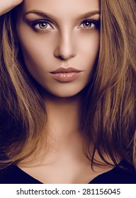 Fashion Studio Portrait Of Beautiful Young Woman With Dark Hair And Green Eyes