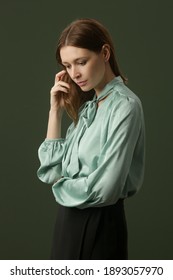 Fashion Studio Shot Of Woman In Mint Green Silk Satin Blouse