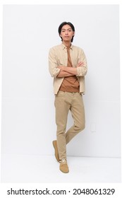 Fashion And Style , Full Body Young Man Wearing Shirt With Khaki Pants With Arms Crossed Posing In Studio