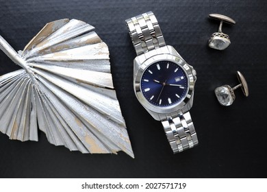 Fashion  Style. Men's Accessories. Mens Watch And Cufflinks Isolated On Black Background 